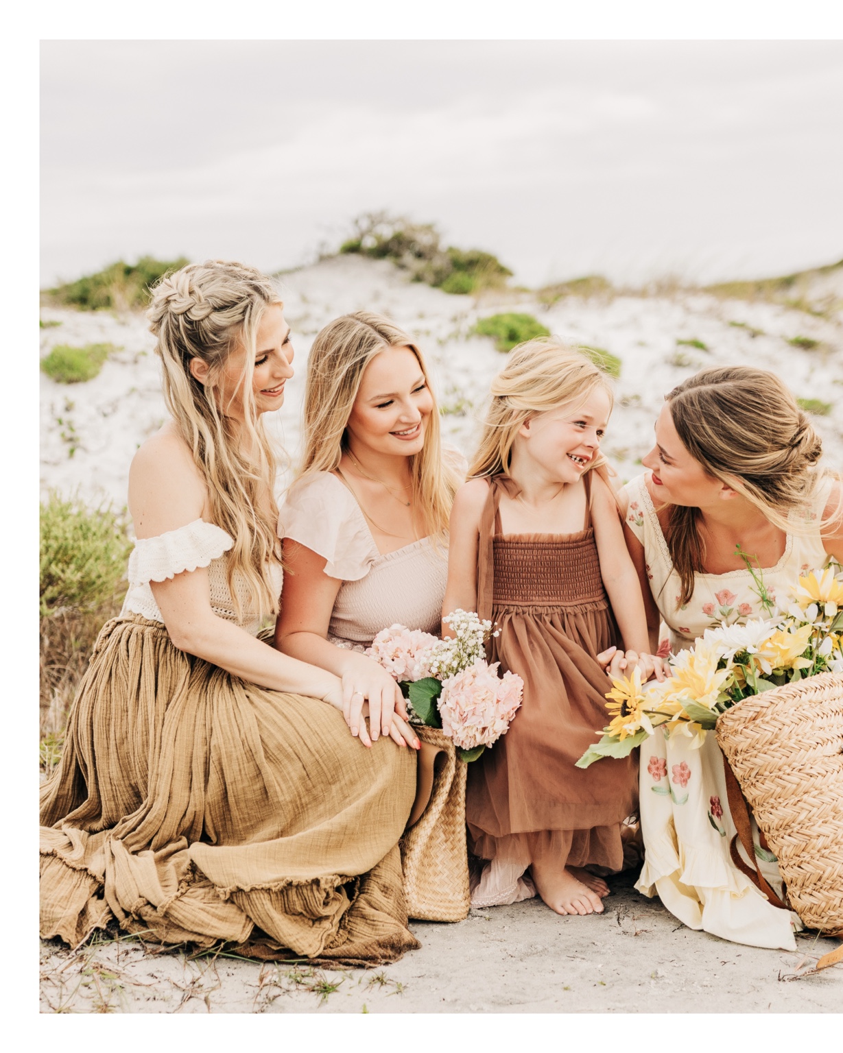 Coordinated warm neutral clothing for a Florida beach portrait session